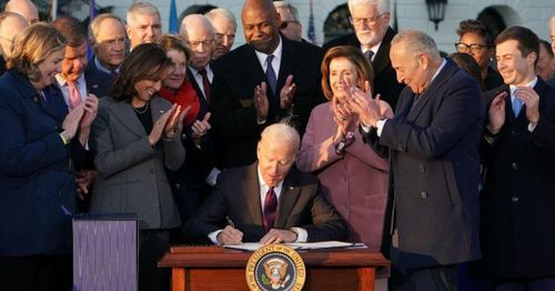 Biden signs Inflation Reduction Act, notching policy win ahead of midterms