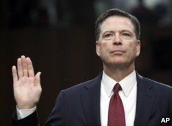 FILE - Former FBI Director James Comey is sworn in during a Senate Intelligence Committee hearing on Capitol Hill in Washington, June 8, 2017.