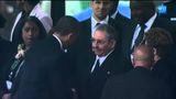 Obama shakes the hand of Raul Castro during Nelson Mandela funeral