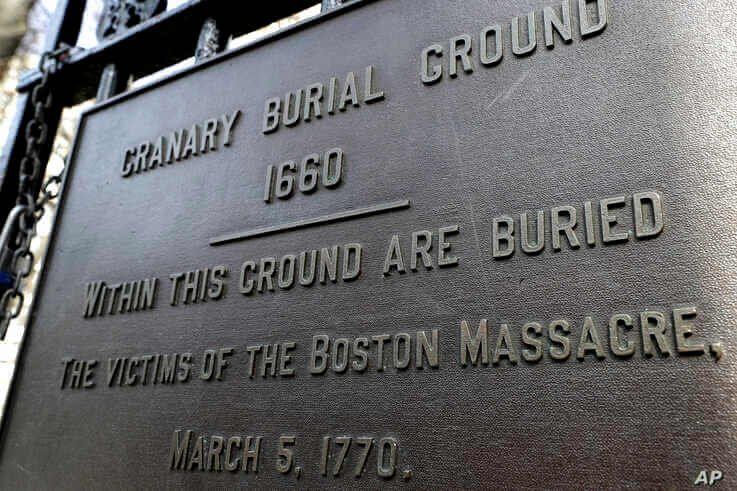 A plaque is posted at the entrance to the Granary Burial Ground in Boston, March 3, 2020.