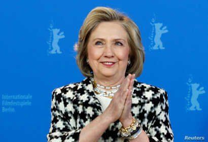 Hillary Clinton gestures as she attends a photo call to promote the movie 