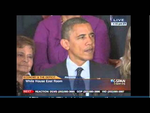 President Obama waves his presidential pen