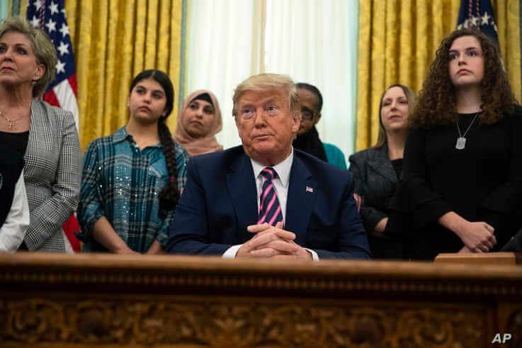 President Donald Trump listens to a question during an event on prayer in public schools, in the Oval Office of the White House…
