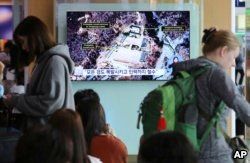 A TV screen shows a satellite image of the Punggye-ri nuclear test site in North Korea during a news program at the Seoul Railway Station in Seoul, South Korea, May 13, 2018.