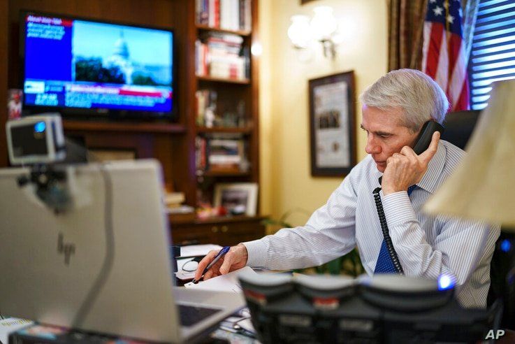 Sen. Rob Portman, R-Ohio, the top Republican negotiator on the bipartisan infrastructure bill, works from his office on Capitol…