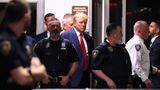 Police officer lets door slam on Trump as he enters courthouse