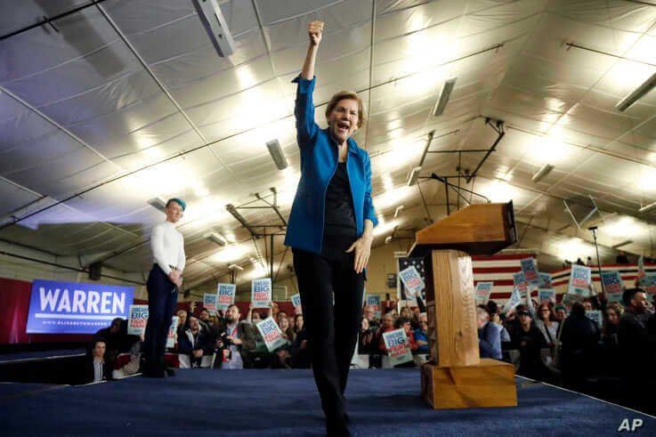 Democratic presidential candidate Sen. Elizabeth Warren, D-Mass., aknowledges supporters at a primary election night rally,…