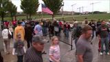 Crowd pushes through barriers to WWII Memorial