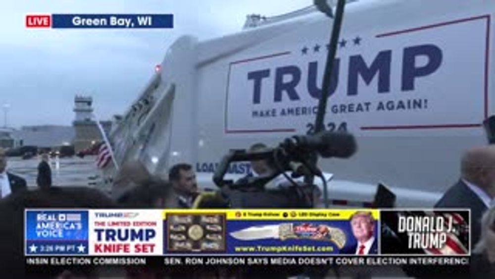 TRUMP RIDING IN A GARBAGE TRUCK TO TONIGHT'S RALLY