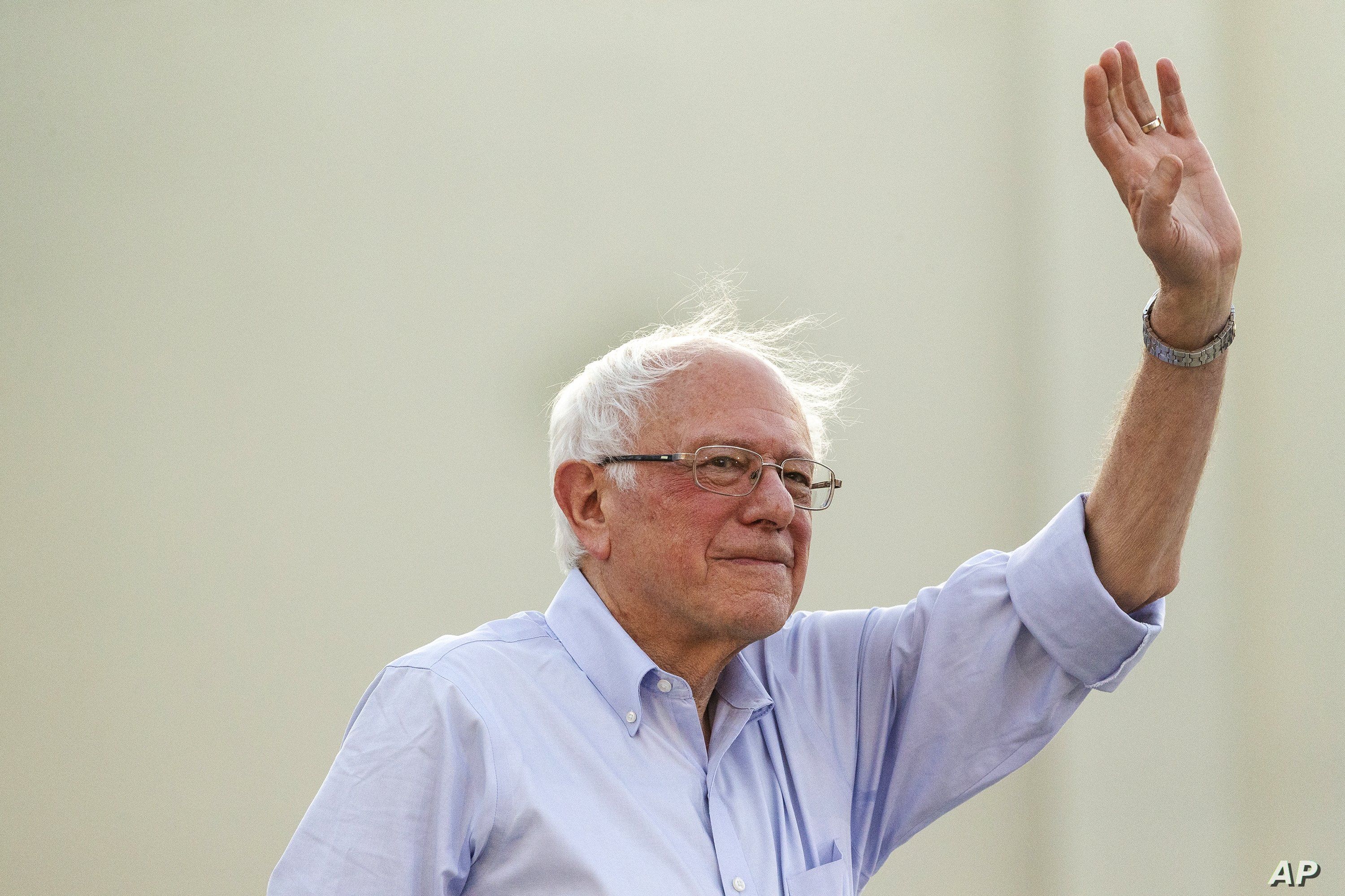 Democratic presidential candidate Sen. Bernie Sanders, I-Vt., waves to supporters as he arrives at a rally at Santa Monica High School Memorial Greek Amphitheater in Santa Monica, Calif., July 26, 2019. 