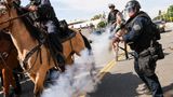 Protests grow violent late Saturday on West Coast