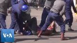 Riot Police Clash With Protesters in Zimbabwe