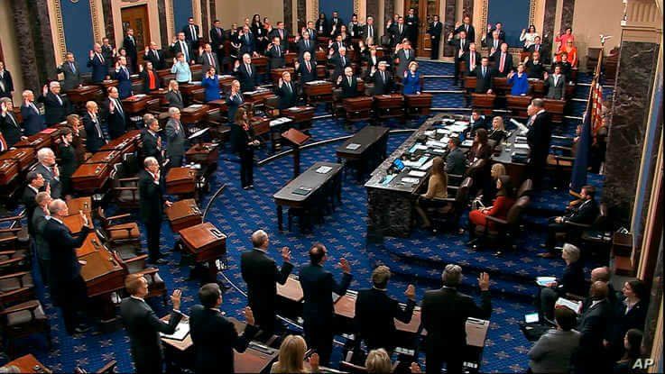 FILE - Supreme Court Chief Justice John Roberts swears in members of the Senate for the impeachment trial of President Donald Trump at the Capitol in Washington, Jan. 16, 2020.