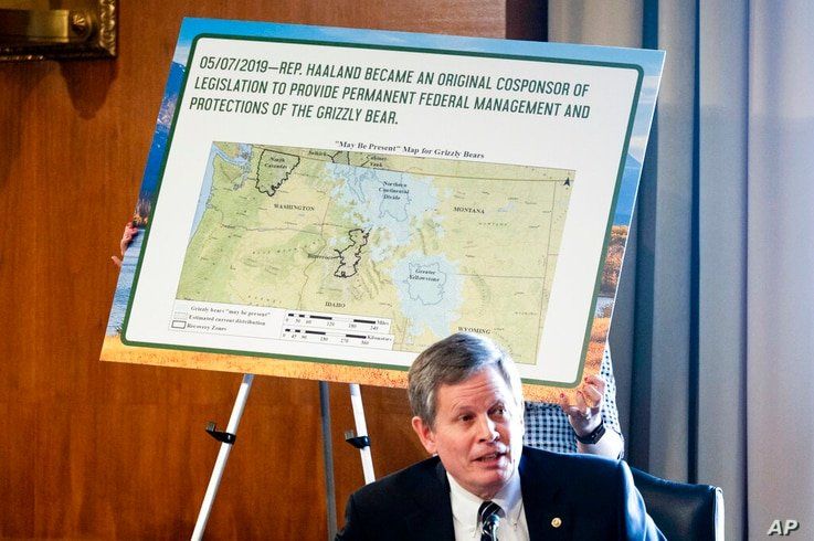 A board is put up as Sen. Steve Daines, R-Mont., speaks during the Senate Committee on Energy and Natural Resources hearing on…