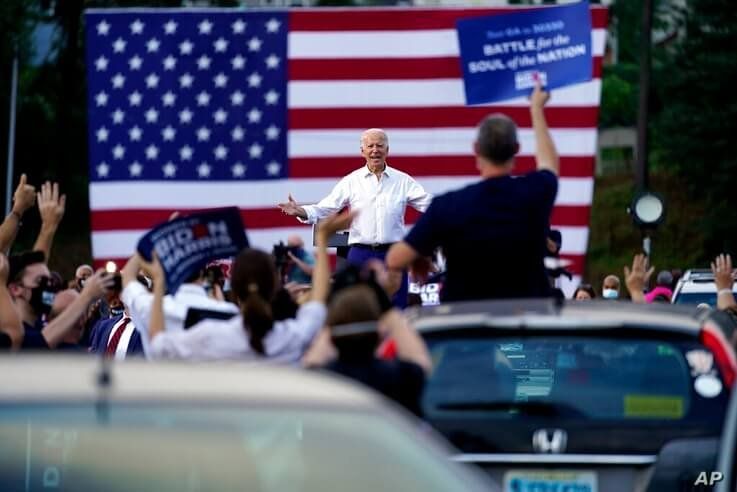 Democratic presidential candidate former Vice President Joe Biden greets supporters at a drive-in rally at Cellairis…