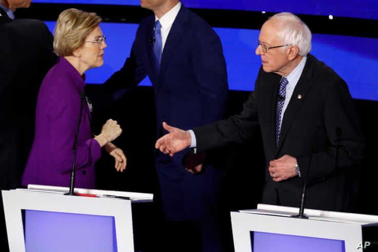 Democratic presidential candidates Sen. Elizabeth Warren and Sen. Bernie Sanders on Jan. 14, 2020, after a Democratic presidential primary debate in Des Moines, Iowa.