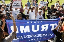 FILE - Protesters clash with Trump supporters in West Palm Beach, Fla., Sept. 22, 2018.