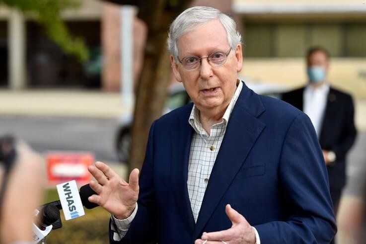 Senate Majority Leader Mitch McConnell, R-Ky., speaks to reporters after casting his vote in the 2020 general election at the…