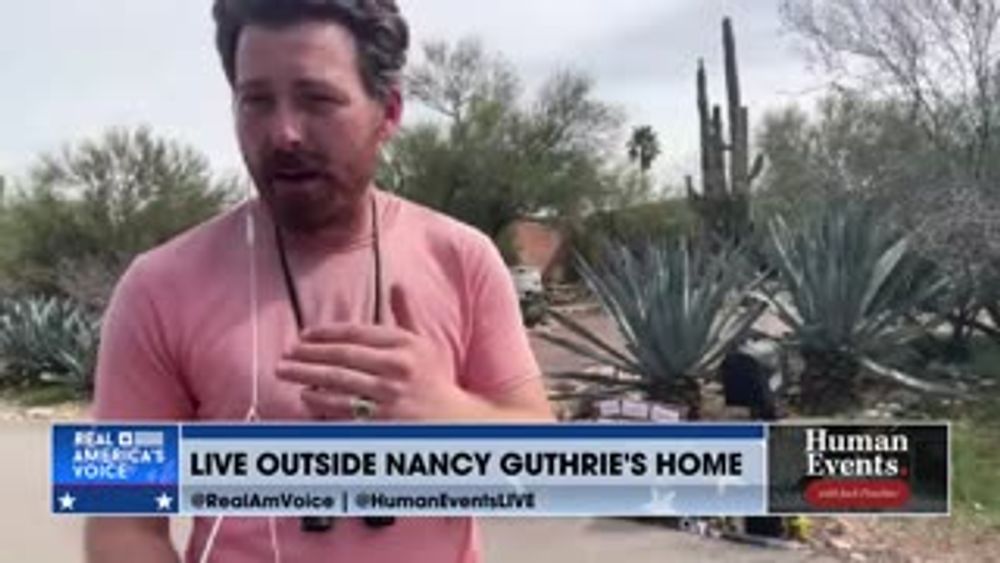 COMMUNITY LAYS FLOWERS AT NANCY GUTHRIE'S HOME