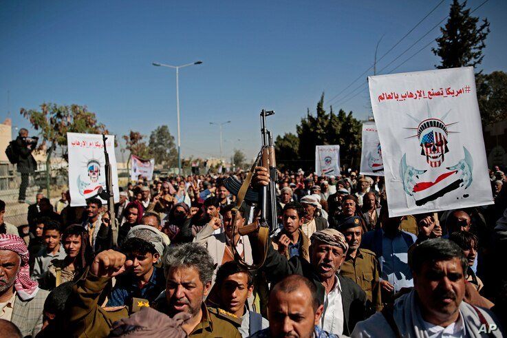 Houthi supporters chant slogans during a rally outside the closed U.S. embassy over obver the decision of the Trump administration to designate the Houthis a foreign terrorist organisation, in Sana'a, Yemen, Jan. 18, 2021.