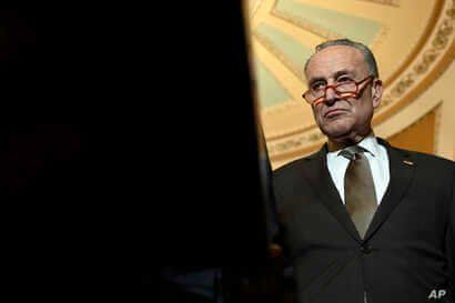 Senate Minority Leader Sen. Chuck Schumer of N.Y., listens during a news conference on Capitol Hill in Washington, Tuesday, Feb…