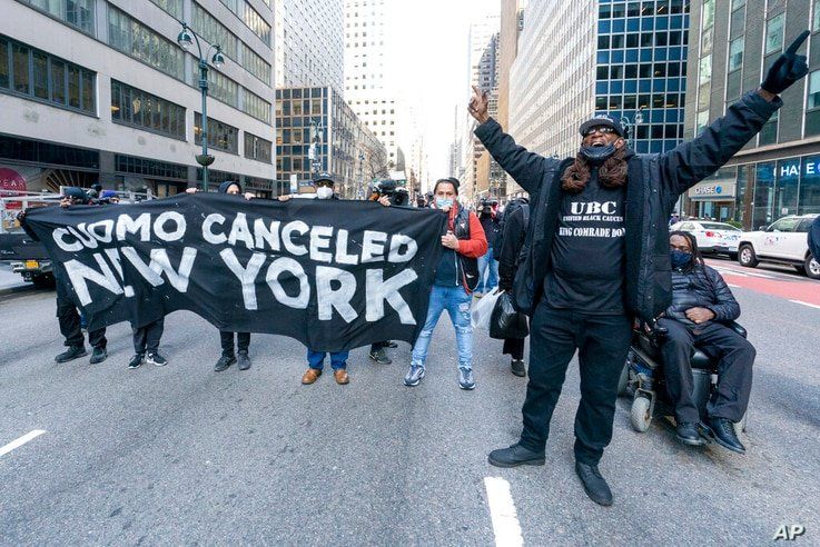 Activist with VOCAL-NY block traffic on 3rd Ave. outside New York Gov. Andrew Cuomo's office, Wednesday, March 10, 2021, in New…