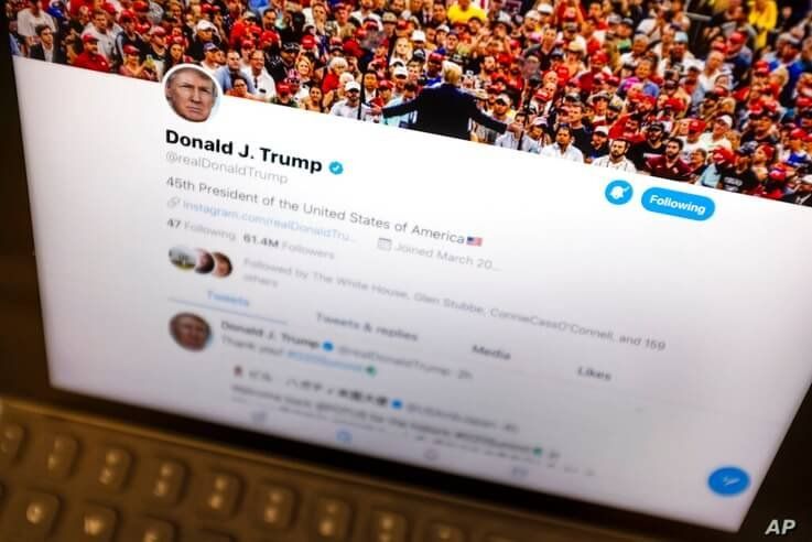 FILE - This June 27, 2019, file photo President Donald Trump's Twitter feed is photographed on an Apple iPad in New York. Amid…