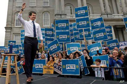 Democratic presidential candidate South Bend, Ind., Mayor Pete Buttigieg waves to supporters outside the Statehouse, Wednesday,…