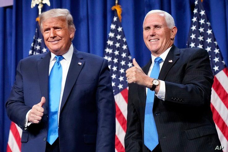 President Donald Trump and Vice President Mike Pence stand on stage during the first day of the 2020 Republican National…