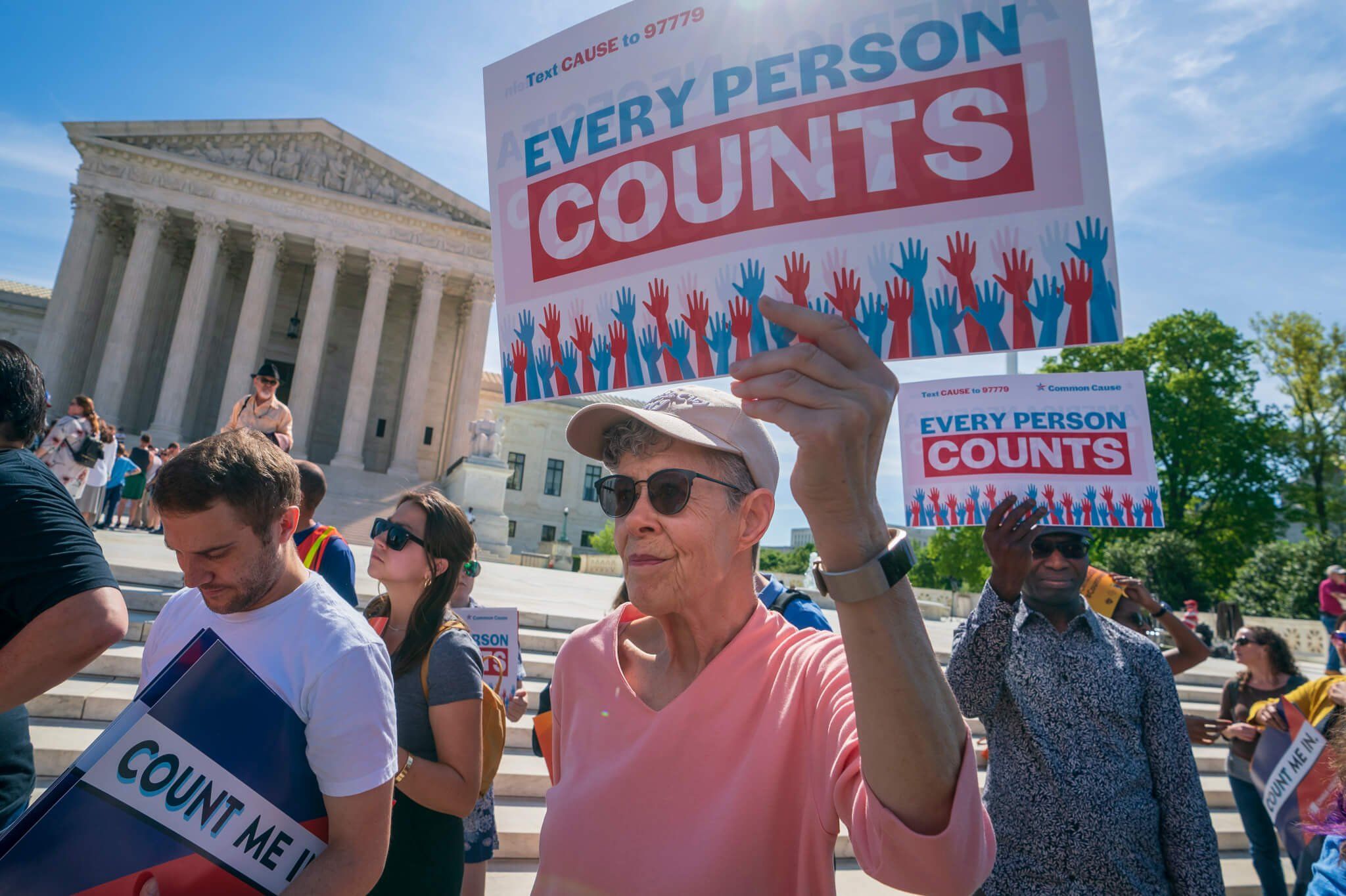 Immigration activists rally outside the Supreme Court as the justices hear arguments over the Trump administration's plan to ask about citizenship on the 2020 census, in Washington, Tuesday, April 23, 2019. Critics say the citizenship question on…