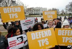 FILE - CASA de Maryland, an immigration advocacy and assistance organization, holds a rally in Lafayette Park, across from the White House in Washington.