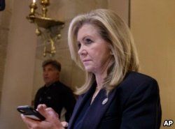 FILE - In this Oct. 26, 2017, file photo, Rep. Marsha Blackburn, R-Tenn., leaves the House chamber after the House gave a significant boost to President Donald Trump's promise to cut taxes on Capitol Hill in Washington.