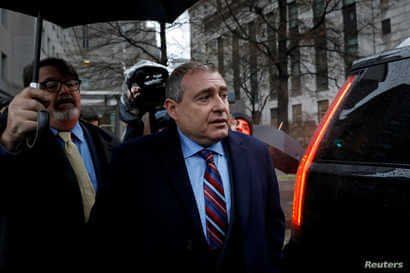 FILE - Lev Parnas, associate of President Donald Trump's personal lawyer Rudy Giuliani, exits after a bail hearing at the Manhattan Federal Court in New York, Dec. 17, 2019.