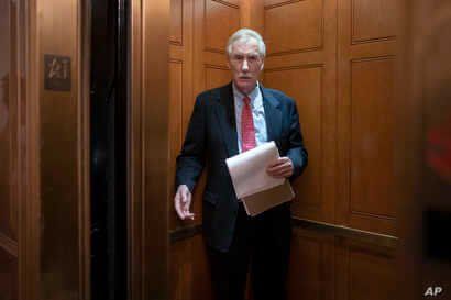 Sen. Angus King, I-Maine, steps into an elevator as he departs the Senate following defense arguments by the Republicans in the…