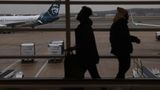 Probe into near-collision at airport finds controllers didn't halt flights amid military flyover