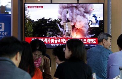 People watch a TV showing a file image of North Korea's missile launch during a news program at the Seoul Railway Station in Seoul, South Korea, Wednesday, Oct. 2, 2019. North Korea on Wednesday fired projectiles toward its eastern sea, South Korea…