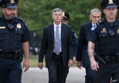 Ambassador William Taylor, is escorted by U.S. Capitol Police as he arrives to testify before House committees as part of the…
