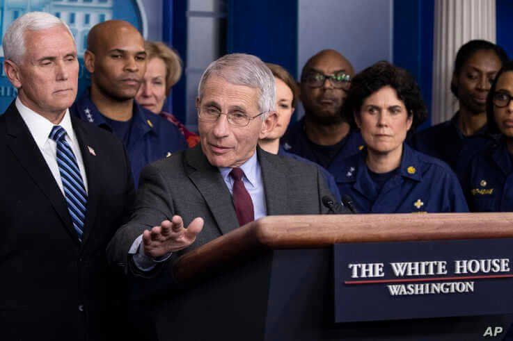 Dr. Anthony Fauci, director of the National Institute of Allergy and Infectious Diseases, with Vice President Mike Pence behind him, speaks during a briefing about the coronavirus in the James Brady Press Briefing Room of the White House, March 15, 2020.