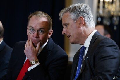 FILE - National Security Adviser Robert C. O'Brien (R) talks with White House chief of staff Mick Mulvaney during a meeting on the sidelines of the United Nations General Assembly, in New York, Sept. 23, 2019.