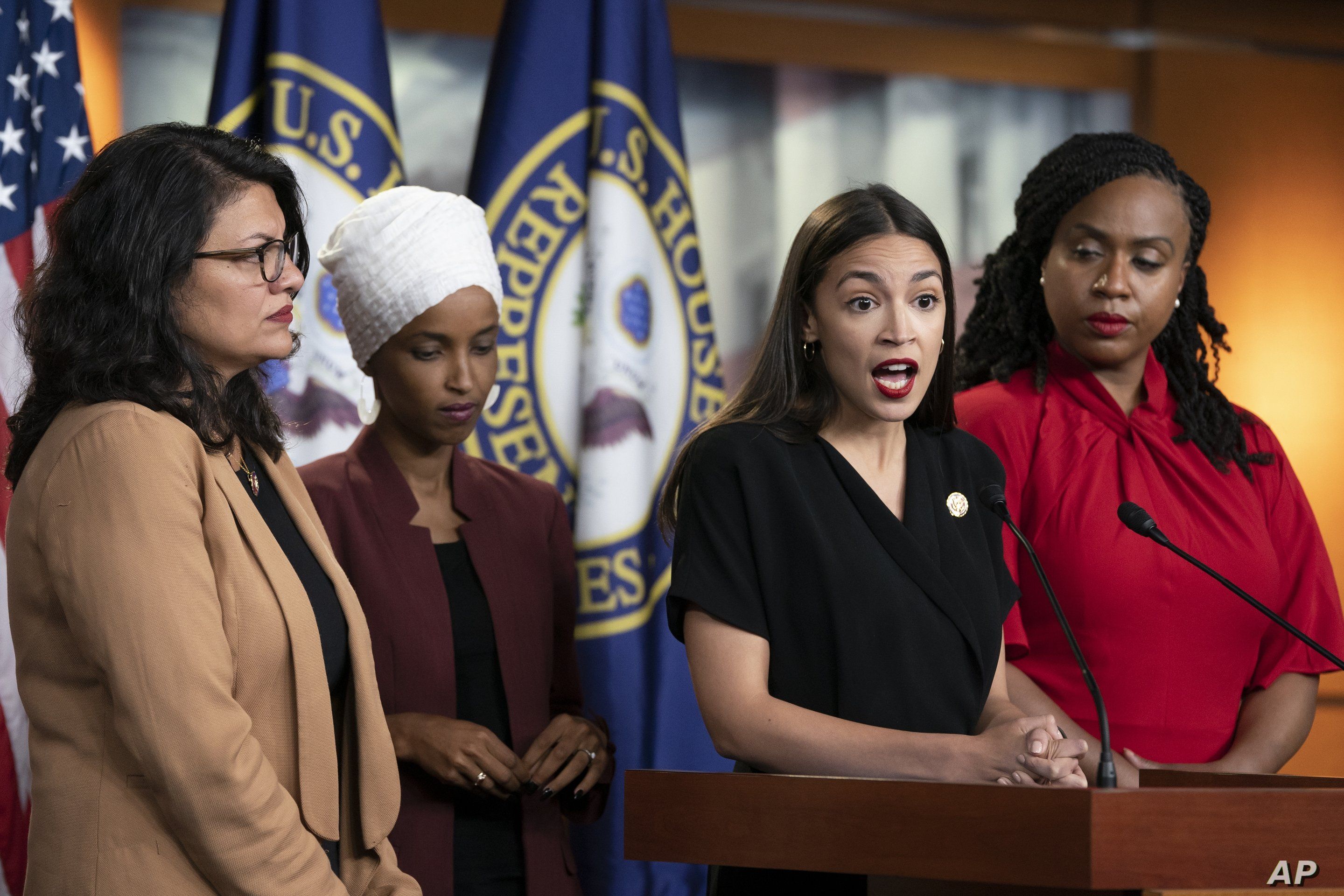 U.S. Rep. Alexandria Ocasio-Cortez, D-N.Y., speaks as, from left, Rep. Rashida Tlaib, D-Mich., Rep. Ilhan Omar, D-Minn., and Rep. Ayanna Pressley, D-Mass., listen during a news conference at the Capitol in Washington, Monday, July 15, 2019…
