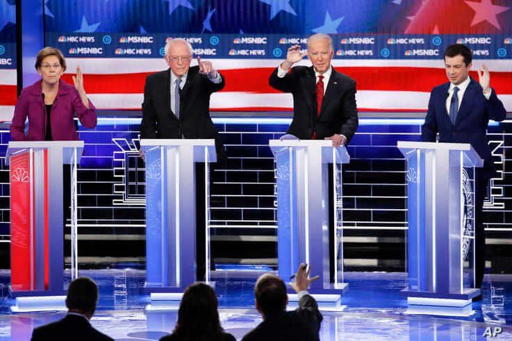 From left, Democratic presidential candidates, former New York City Mayor Michael Bloomberg, Sen. Elizabeth Warren, D-Mass.,…