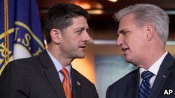 Speaker of the House Paul Ryan, R-Wis., left, confers with House Majority Leader Kevin McCarthy, R-Calif., during a news conference on Capitol Hill in Washington, May 16, 2018. The GOP leadership praised the work of the Agriculture Committee in crafting the farm bill which conservative Republicans scuttled in an immigration protest.