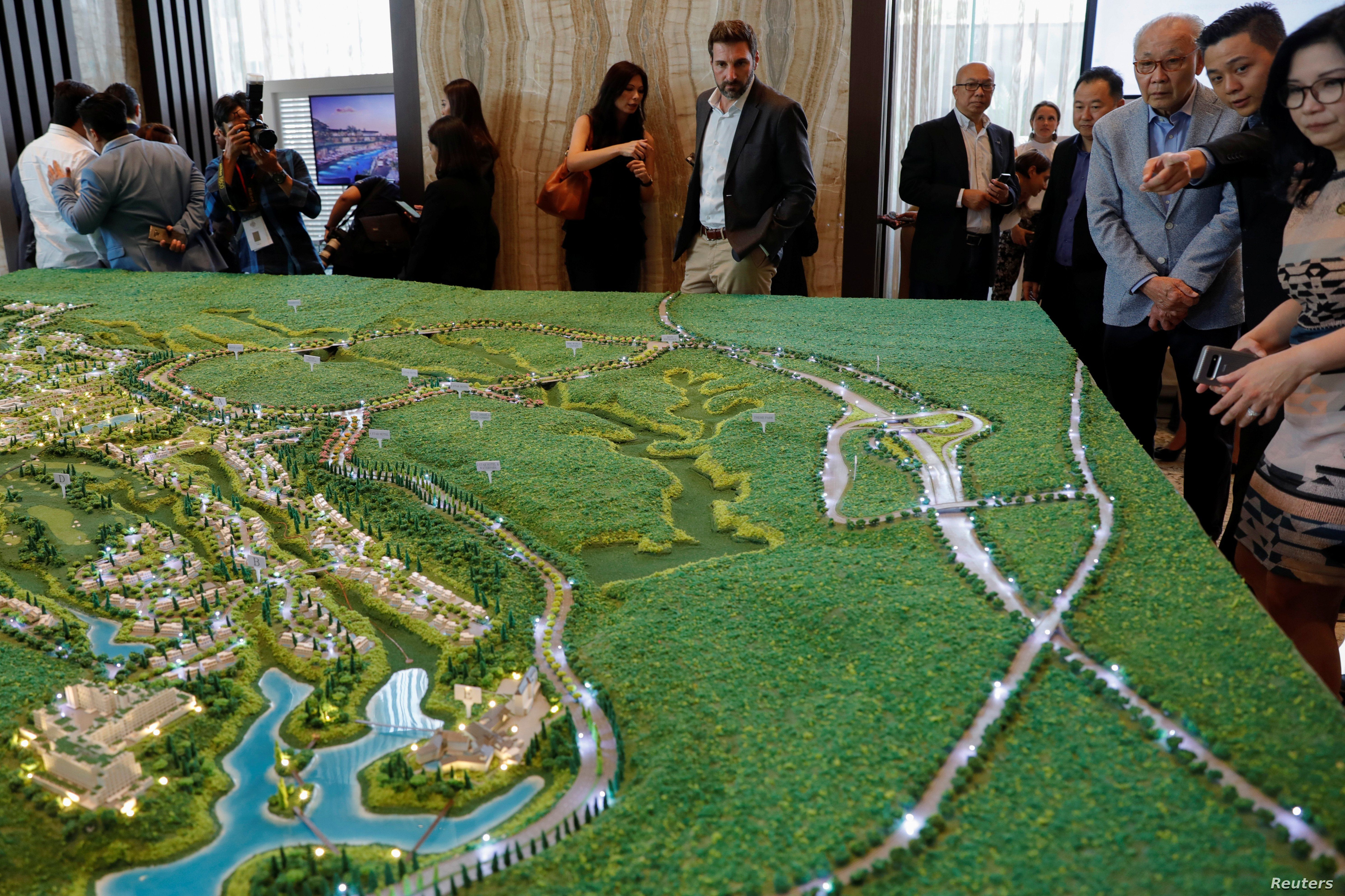 Visitors look at the models of Trump Residences Lido during the pre-launch of the Trump Residences, in Jakarta, Indonesia, Aug. 13, 2019.