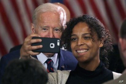 Democratic presidential candidate and former Vice President Joe Biden takes a selfie at a campaign event, Wednesday, Oct. 9,…