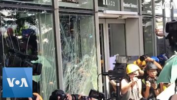 Hong Kong Protesters Smash Glass Door of the Legislature