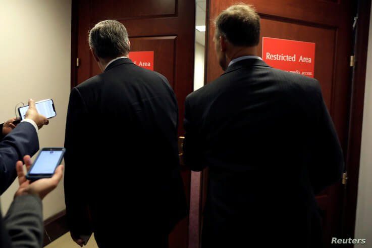 Members of Congress head to a resticted area for a closed-door deposition held as part of House Democrats' impeachment inquiry into President Donald Trump on Capitol Hill in Washington, Oct. 23, 2019.