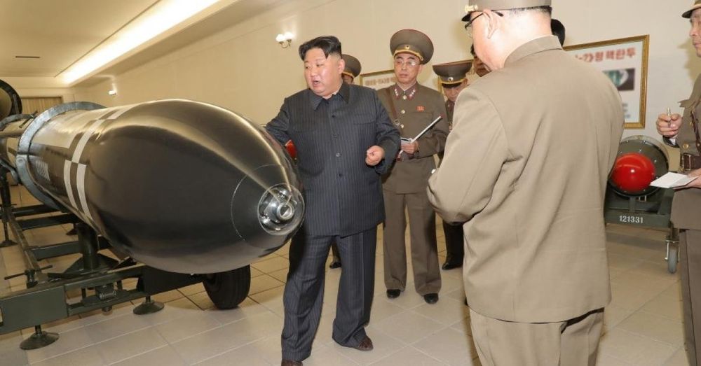 North Korea tests new strategic missiles from destroyer as leader Kim Jong-un looks on