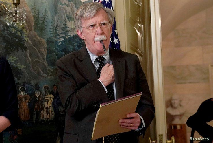 FILE PHOTO: Former National Security Adviser John Bolton listens to U.S. President Donald Trump's statement on Syria at the…