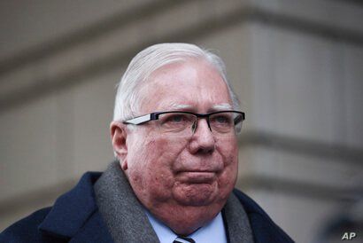 Jerome Corsi listens during a news conference outside the federal courthouse in Washington, Jan. 3, 2019. 