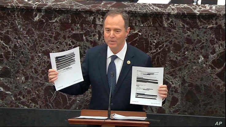 In this image from video, House impeachment manager Rep. Adam Schiff holds redacted documents as he speaks during the impeachment trial of President Donald Trump, in the Senate at the Capitol in Washington, Jan. 22, 2020.